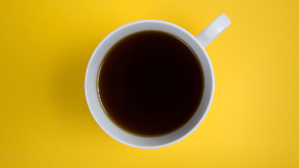Canva Coffee Cup Overhead On Bright Yellow Background