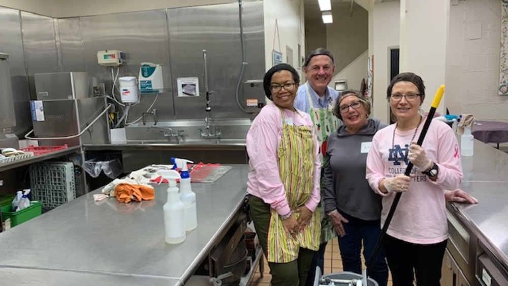 Pictured, left to right, in the kitchen at St. Margaret's House are Dawn Foster, assistant director of finance and administration; Matt Zyniewicz, the dean's executive administrator;
Linda Brady, office services coordinator; and
Sarah Mustillo, the I.A. O'Shaughnessy Dean.