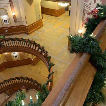 The Christmas decorations were undisturbed while workers removed and then installed carpet in Main Building.