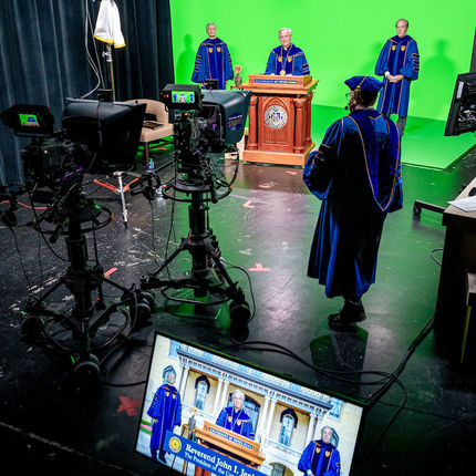 University of Notre Dame Provost Thomas Burish, President Rev. John I. Jenkins, C.S.C., and Board of Trustees Chair Jack Brennan, left to right, gather in Notre Dame Studios for the 2020 Degree Conferral Ceremony. (Photo by Matt Cashore/University of Notre Dame)