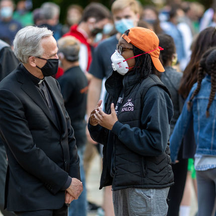 Rev. John I. Jenkins, president of the University of Notre Dame, speaks with a young woman following the “Prayer for Unity, Walk for Justice” on Monday, June 1. (Photo by Matt Cashore/University of Notre Dame)
