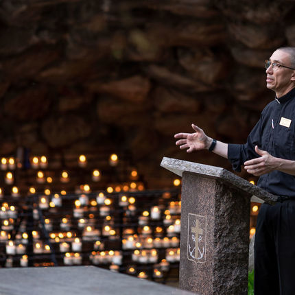 Rev. Pete McCormick, C.S.C., director of Campus Ministry, leads prayer at the Grotto at the 