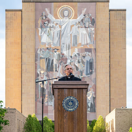 Rev. John I. Jenkins, president of the University of Notre Dame, leads vigil attendees in prayer. An estimated 1,000 people attended the 