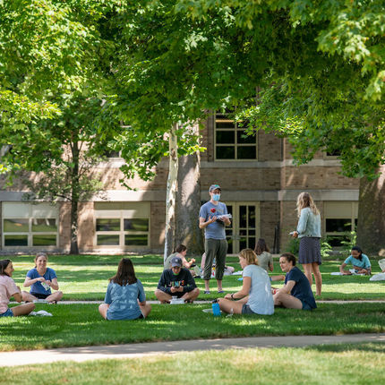 Students enjoy their lunch outside North Dining Hall while practicing physical distancing. (Photo by Barbara Johnston/University of Notre Dame)