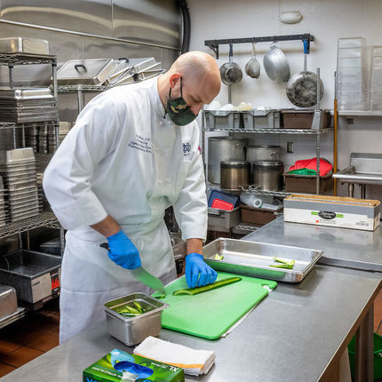 Josh Maron, Legends executive chef, prepares food in the kitchen at Legends.