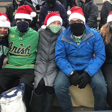 Brittney Huber, Connor Huber, Amy Huber, office assistant at Cedar Grove Cemetery, Nathaniel Kemiel and Kimberly Snyder enjoy a Notre Dame win.