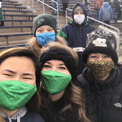 (Front row, left to right) Jade, Paige and Gwen O'Brien, director of internal communications, along with (back row, left to right) Grace and Terry O'Brien brave the cold to cheer on the Irish.