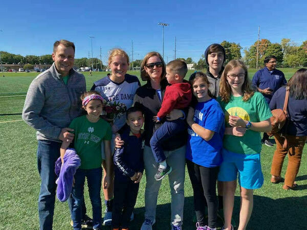 The Dolezals supporting veteran student Claire Krueger’23 at one of her club soccer games last fall.