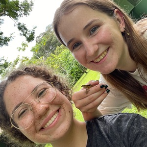 Sophia Daly (left) and Aisling Kruger (right) with an anolis lizard that they found in their bedroom at Hacienda Baru Wildlife Refuge.