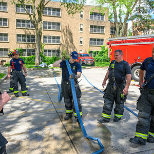 Firefighters standing outside.